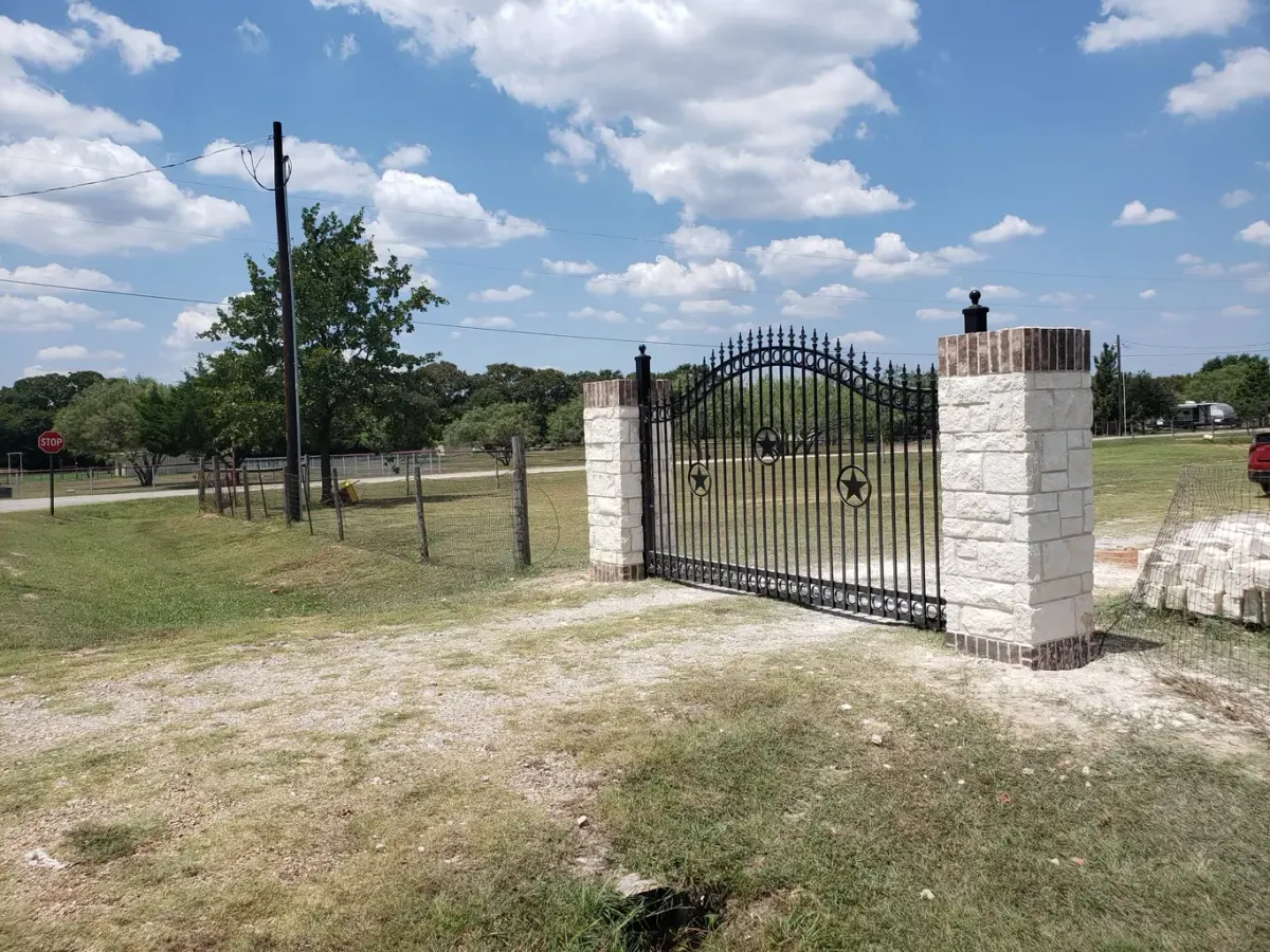 Stone and brick gate pillars at a residential entrance
